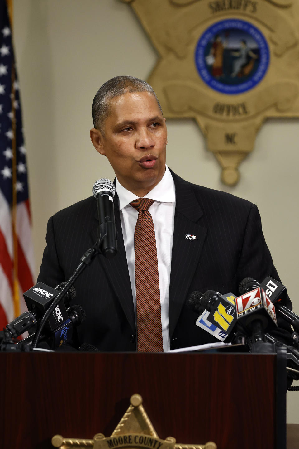 Secretary of North Carolina Department of Public Safety Eddie M Buffaloe speaks on Monday, Dec. 5, 2022, at a news conference at the Moore County Sheriff's Office in Carthage, N.C., regarding an attack on critical infrastructure that has caused a power outage to many around Moore County. (AP Photo/Karl B DeBlaker)