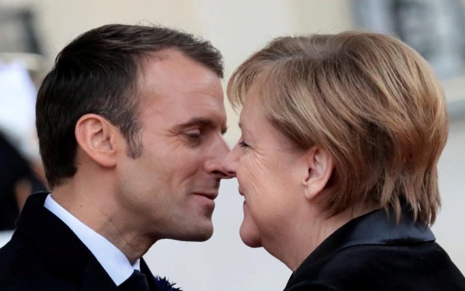 A French pensioner mistook Chancellor Angela Merkel of Germany for the wife of President Emmanuel Macron of France - REUTERS