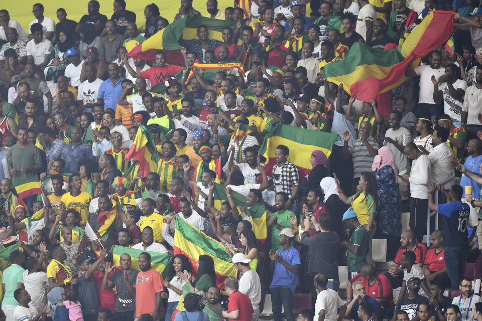 Ethiopia supporters hold flags on the stands during the World Athletics Championships in Doha, Qatar, Monday, Sept. 30, 2019. (AP Photo/Martin Meissner)