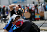 Demonstrators clash with riot security forces while rallying against Venezuela's President Nicolas Maduro's government in Caracas, Venezuela, July 28, 2017. REUTERS/Andres Martinez Casares