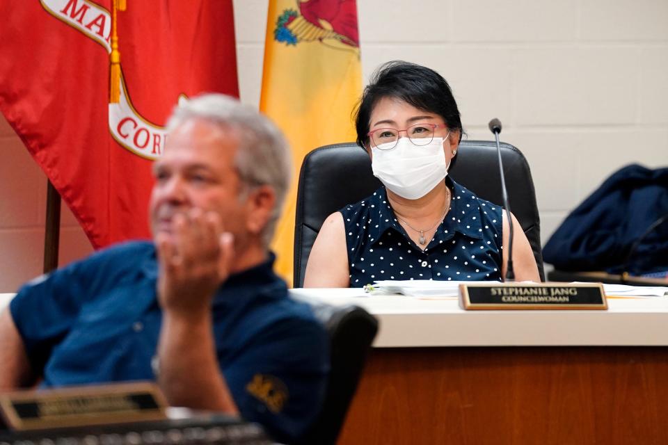 Palisades Park councilwoman Stephanie Jang, right, listens as borough administrator David Lorenzo answers a question during a borough council meeting on Monday, May 23, 2022.