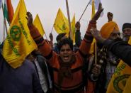 Farmers shout slogans during a protest against farm laws at Ghaziabad