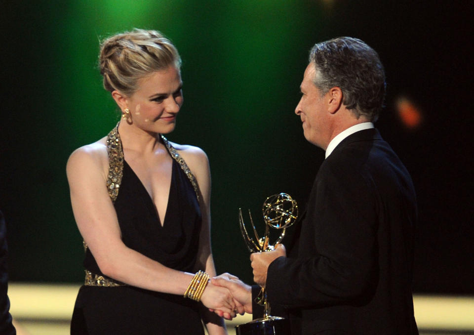 LOS ANGELES, CA - SEPTEMBER 18:  Jon Stewart accepts the Outstanding Variety, Music Or Comedy Series award from actress Anna Paquin onstage during the 63rd Annual Primetime Emmy Awards held at Nokia Theatre L.A. LIVE on September 18, 2011 in Los Angeles, California.  (Photo by Kevin Winter/Getty Images)