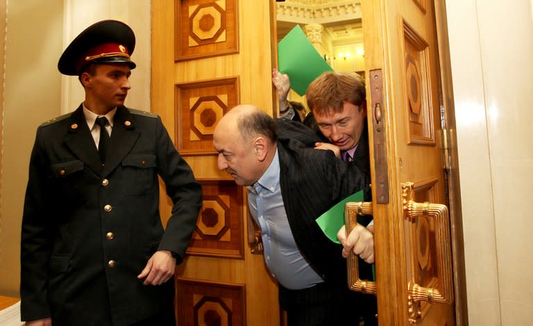 Ukrainian deputies push and shove on December 12, 2012 before the opening ceremony of the newly elected Ukrainian parliament in Kiev. The opening session of the Verkhkovna Rada began in a typically raucous fashion, after the October 28 parliamentary elections which were condemned by the West as a setback for democracy