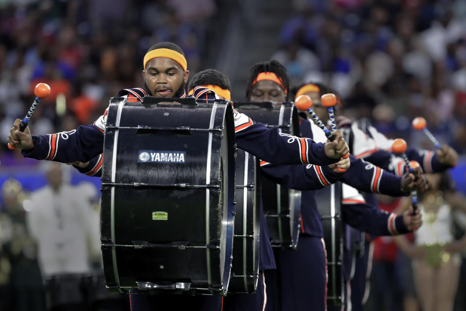 The Langston University Marching Pride marching band bass drum line performs during the 2023 National Battle of the Bands, a showcase for HBCU marching bands, held at NRG Stadium, Saturday, Aug. 26, 2023, in Houston. (AP Photo/Michael Wyke)
