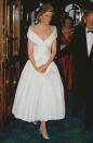 <p>Princess Diana looked dreamy in this shoulder-hugging white dress, which she wore to an English National Opera production in May 1988.</p>