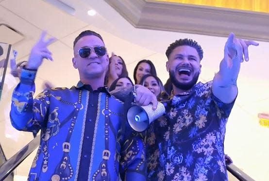 Mike "The Situation" Sorrentino (left) and Pauly DelVecchio lead the cast of "Jersey Shore Family Vacation" on an escalator in Atlantic City during the show's Feb. 29 episode.