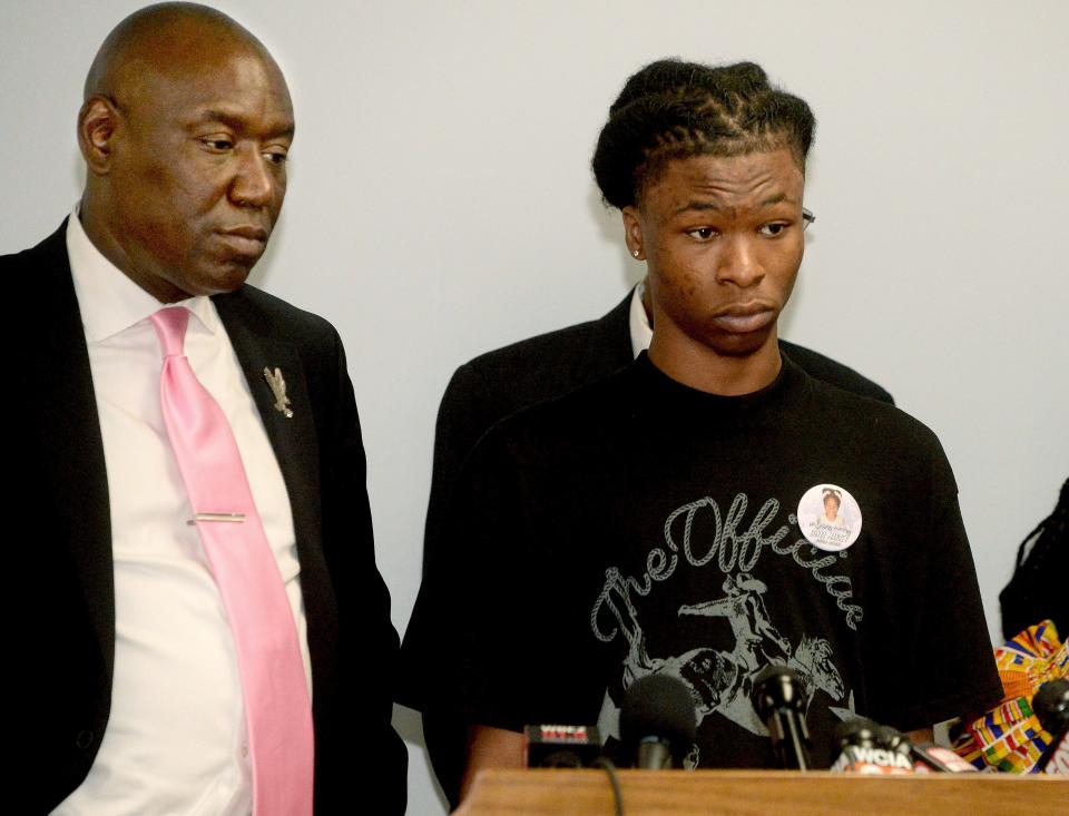 Malachi Hill Massey, right, the son of Sonya Massey, stands next to civil rights attorney Ben Crump, as Hill talks about his mother and what happen the day she was shot and killed during a press conference at the Springfield NAACP building in Springfield on July 26, 2024.