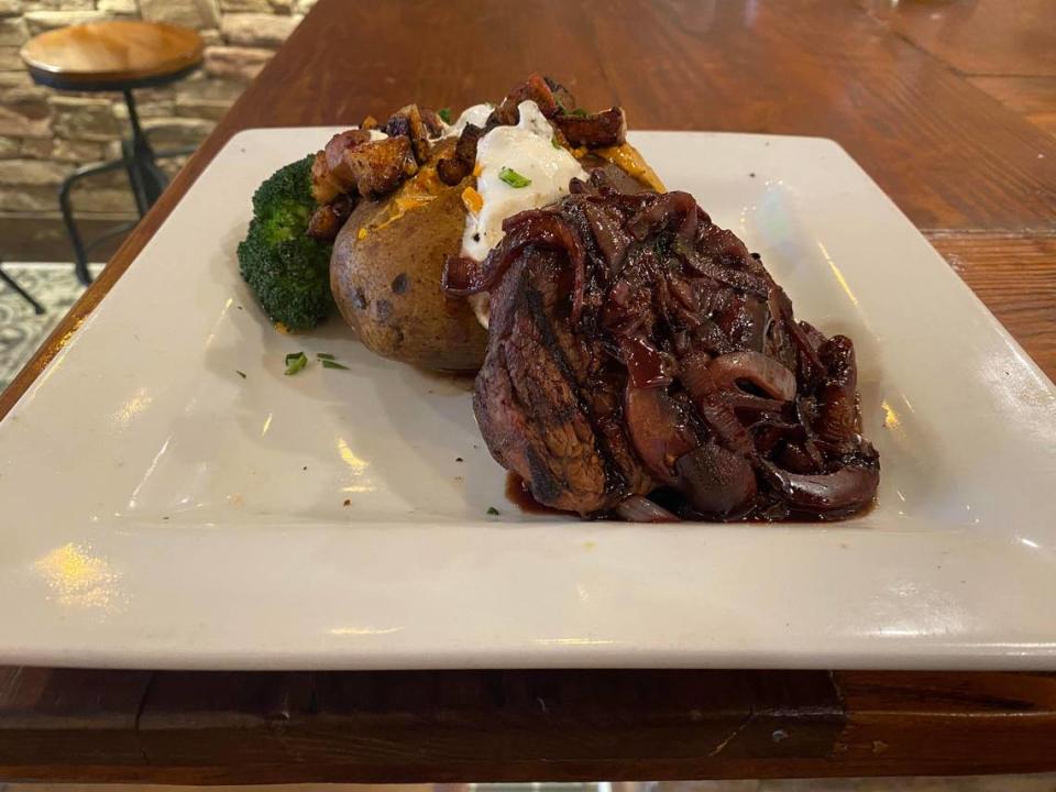 An 8 ounce filet topped with mushroom red wine sauce and served with choice of baked or sweet potato and collard greens or vegetable of the day.