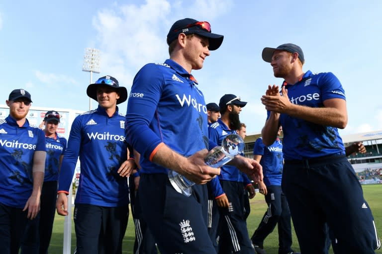 England's captain Eoin Morgan (C) leaves the field with teammates at the end of an ODI match against West Indies, at the Kensington Oval Stadium in Bridgetown, Barbados, in March 2017