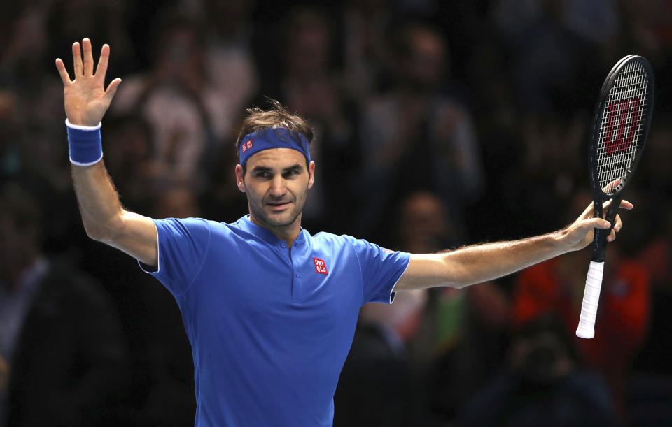 Switzerland's Roger Federer celebrates winning his ATP World Tour Finals men's singles tennis match against South Africa's Kevin Anderson at the O2 arena in London, Thursday, Nov. 15, 2018. (John Walton/PA via AP)