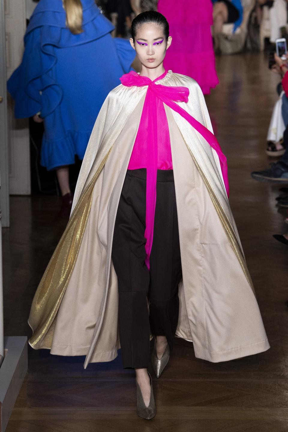 Valentino’s Fall 2018 Couture look, with an elegant bow top and dramatic cape, is worth a red carpet posing session.