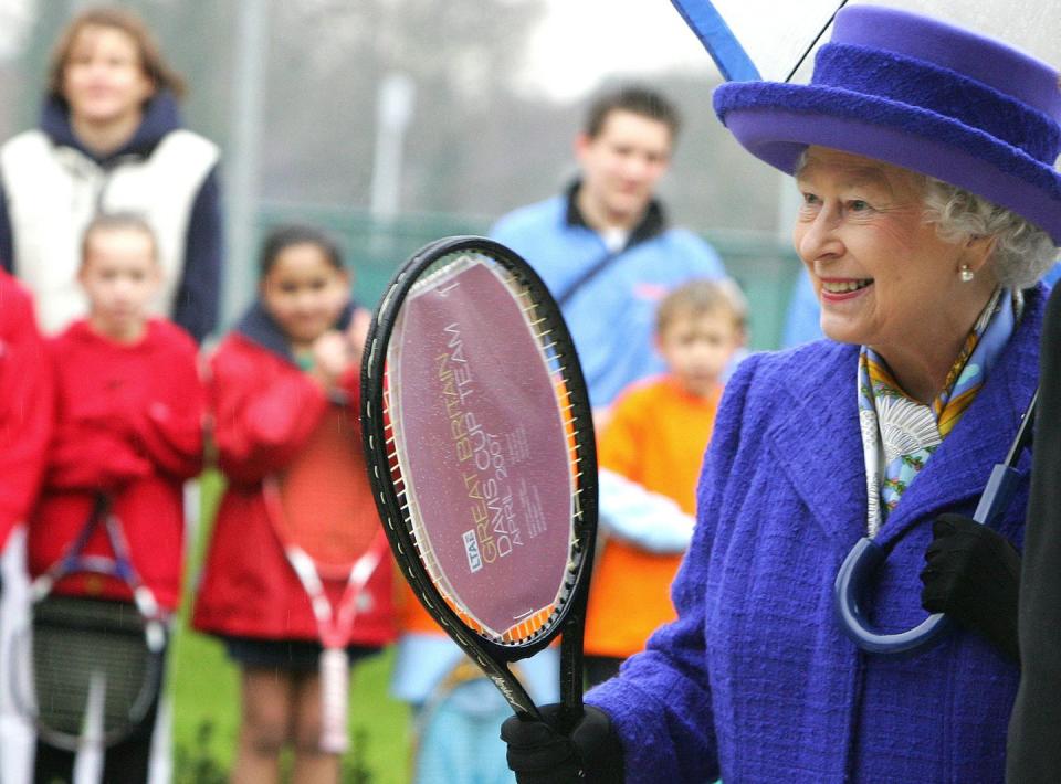 <p>Queen Elizabeth may not have inherited her father's tennis form (Her Majesty is famously more of a riding and racing fan) but she was clearly please to receive a racket from the British Davis Cup.<br></p>