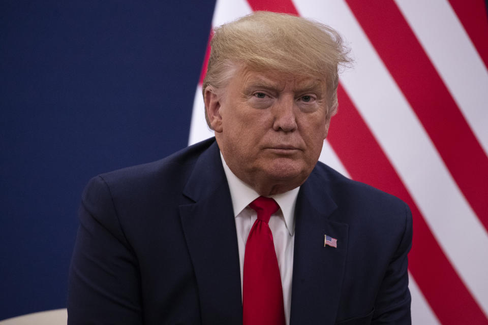 President Donald Trump listens to a question during a meeting with Swiss President Simonetta Sommaruga at the World Economic Forum, Tuesday, Jan. 21, 2020, in Davos, Switzerland. (AP Photo/ Evan Vucci)