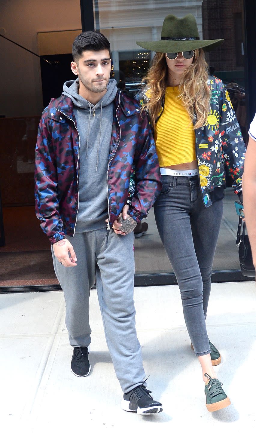 <p>In an Adidas Originals by Pharrell Williams jacket, Puma x Fenty by Rihanna creepers, a yellow cutoff shirt, Tommy Hilfiger briefs and black skinny jeans. Hadid topped off the casual look with a forest green floppy hat, rounded specs and arm candy – her rockstar boyfriend Zayn.</p>