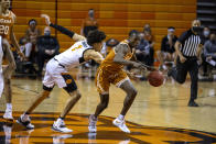 Oklahoma State guard Cade Cunningham (2) reaches for the ball as Texas guard Andrew Jones (1) dribbles down the court during the first half of the NCAA college basketball game in Stillwater, Okla., Saturday, Feb. 6, 2021. (AP Photo/Mitch Alcala)