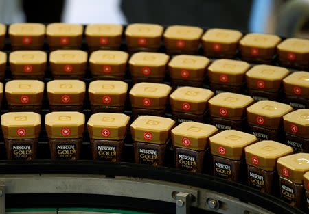 Packages of Nescafe coffee are pictured in the production facility in Orbe, Switzerland March 25, 2013. REUTERS/Denis Balibouse/File Photo