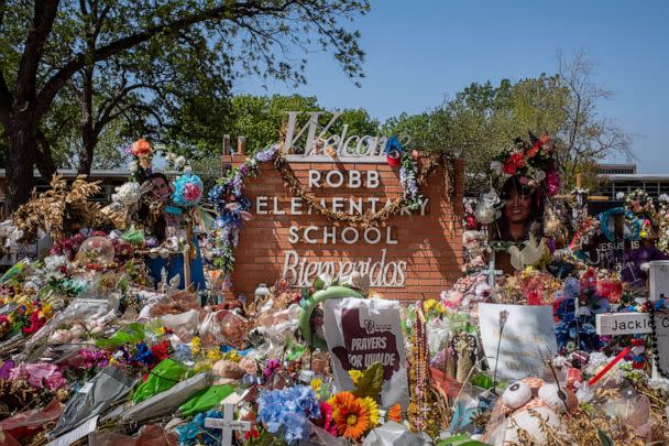 PHOTO: The Robb Elementary School sign is seen covered in flowers and gifts on June 17, 2022 in Uvalde, Texas. (Brandon Bell/Getty Images, FILE)