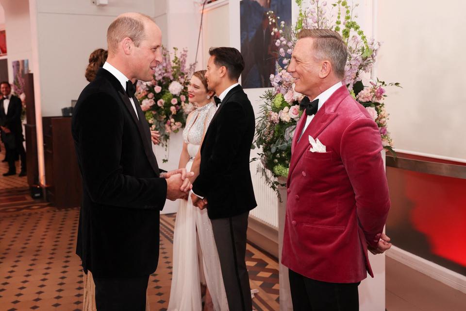 Britain's Prince William, Duke of Cambridge (L) talks to English actor Daniel Craig ahead of the World Premiere of the James Bond 007 film "No Time to Die" at the Royal Albert Hall in west London on September 28, 2021.