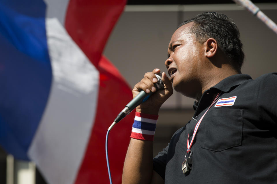 Chumphon Junlasai, one of protest leaders, speaks during an anti-government protest outside the Royal Thai Police headquarters, Tuesday, Jan. 14, 2014, in Bangkok. Thailand's political crisis ground on Tuesday as the country's prime minister reiterated her refusal to quit as protesters trying to topple her administration blocked key roads in the heart of Bangkok for a second day. (AP Photo/John Minchillo)