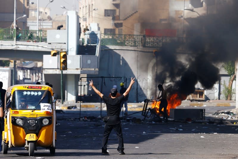 Demonstrator gestures during the ongoing anti-government protests in Baghdad