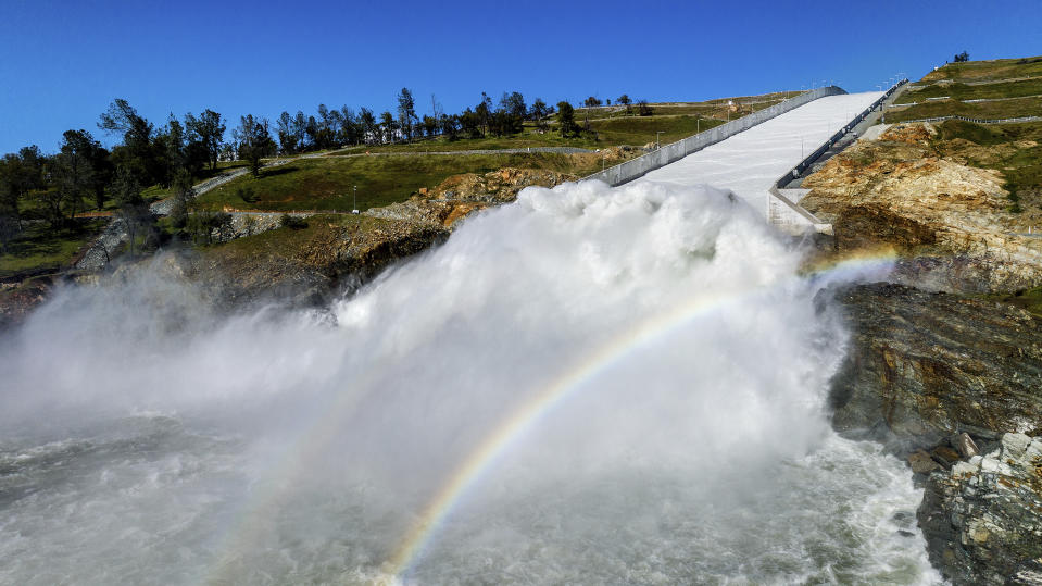 FILE - Water rushes out of the Oroville Spillway at Lake Oroville on March 26, 2023, in Butte County, Calif. California ended its 2022-23 water year on Saturday, Sept. 30, 2023. After years of severe drought, the reservoirs in the state water project ended the year at 128% of their historical average. That includes Lake Oroville. (AP Photo/Noah Berger, File)