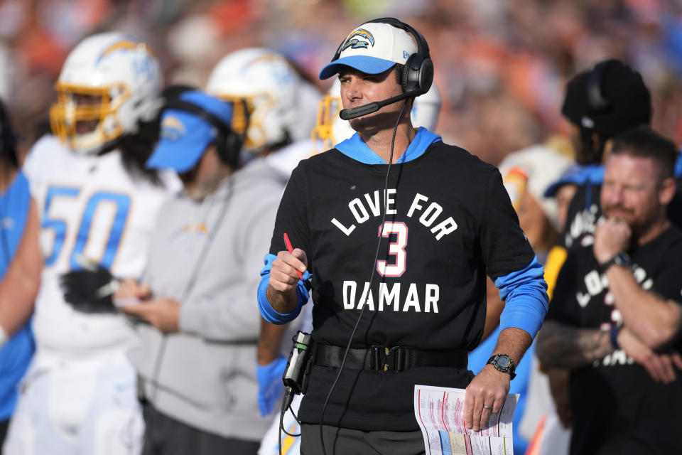 Los Angeles Chargers head coach Brandon Staley wears a T-shirt to show support for Buffalo Bills safety Damar Hamlin during the first half of an NFL football game against the Denver Broncos in Denver, Sunday, Jan. 8, 2023. (AP Photo/David Zalubowski)