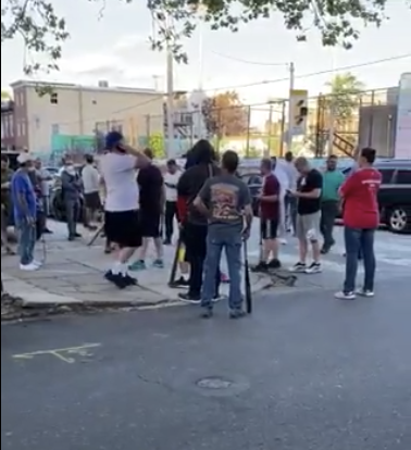 Members of the group on a street corner. Source: Twitter/ Jon Ehrens