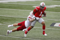 Nebraska linebacker Will Honas, left, tackles Ohio State quarterback Justin Fields during the first half of an NCAA college football game Saturday, Oct. 24, 2020, in Columbus, Ohio. (AP Photo/Jay LaPrete)