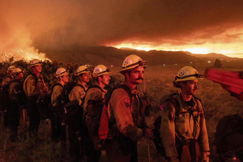 Firefighters monitor the Sugar Fire, part of the Beckwourth Complex Fire, in Doyle, California, on July 9, 2021. / Credit: Noah Berger / AP