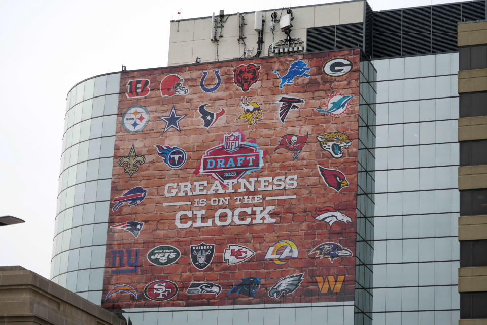 Signage promoting the 2023 NFL Draft with team logos in downtown. Mandatory Credit: Kirby Lee-USA TODAY Sports