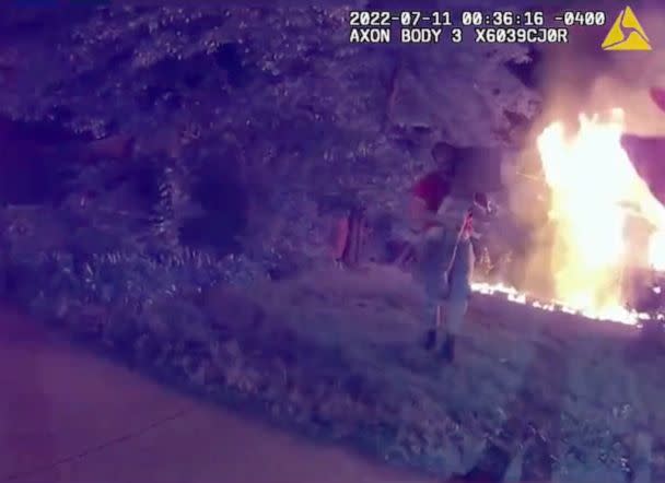 PHOTO: Bodycam video shows Nicholas Bostic carrying a child from a house fire in Lafayette, Ind., July 11, 2022. (Lafayette Police)