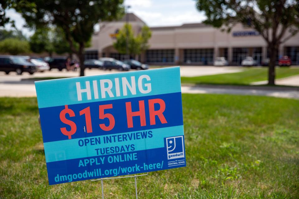 A help-wanted sign in front of Goodwill of Central Iowa's Waukee store in August 2021. Iowa's unemployment rate in June, reported Thursday, dropped to a  pre-pandemic level.