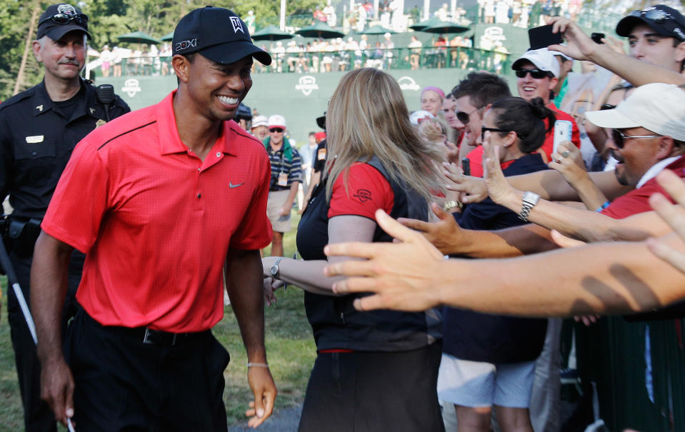 Tiger Woods is congratulated by fans after winning the AT&T National at Congressional Country Club on July 1, 2012 in Bethesda, Maryland. (Photo by Rob Carr/Getty Images)