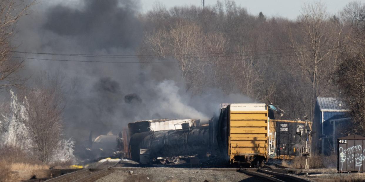 Smoke rises from a derailed cargo train in East Palestine, Ohio, on February 4, 2023. - The train accident sparked a massive fire and evacuation orders, officials and reports said Saturday. No injuries or fatalities were reported after the 50-car train came off the tracks late February 3 near the Ohio-Pennsylvania state border. The train was shipping cargo from Madison, Illinois, to Conway, Pennsylvania, when it derailed in East Palestine, Ohio. (Photo by DUSTIN FRANZ / AFP) (Photo by DUSTIN FRANZ/AFP via Getty Images)