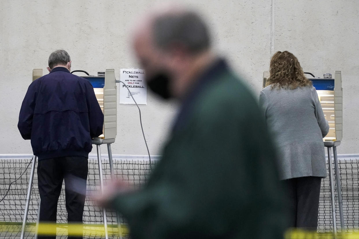 People vote at the Milwaukee County Sports Complex, on Nov. 3, 2020, in Franklin, Wis. (AP Photo/Morry Gash)