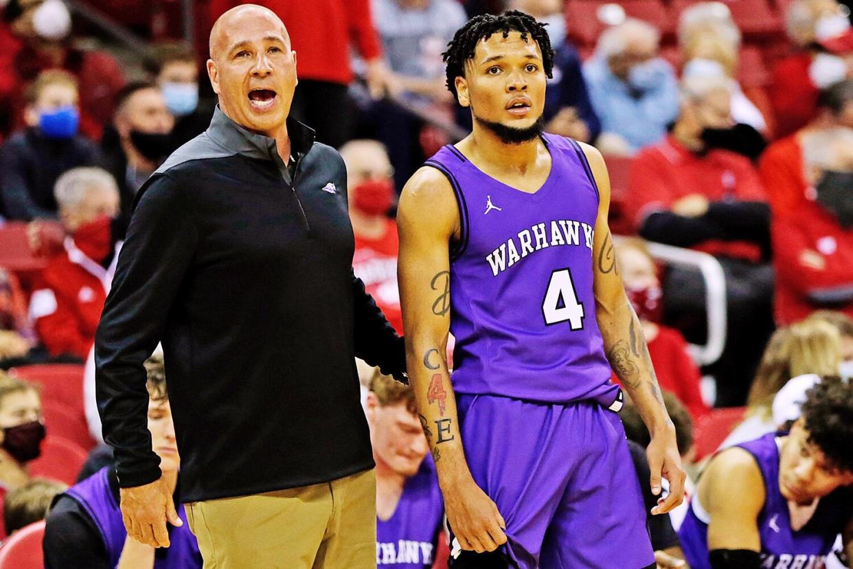 MADISON, WISCONSIN - OCTOBER 29: UW-Whitewater head coach Pat Miller and Derek Gray #4 look on in the first half against the Wisconsin Badgers during the exhibition game at Kohl Center on October 29, 2021 in Madison, Wisconsin. (Photo by John Fisher/Getty Images)
