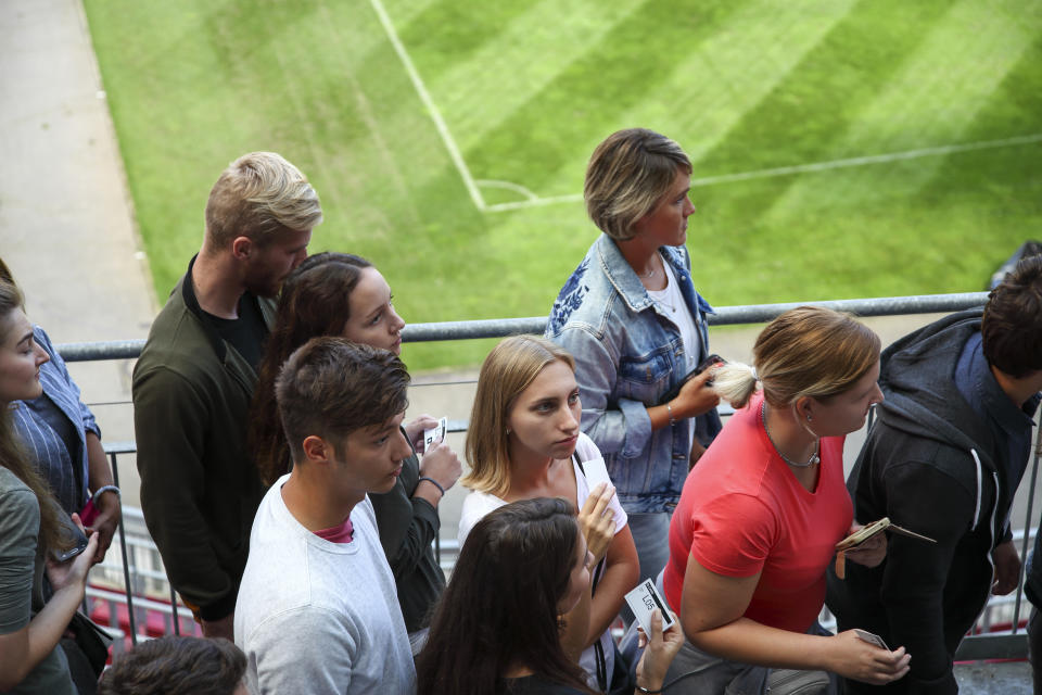 Line of people on the stadium gates, waiting to get to their seats.