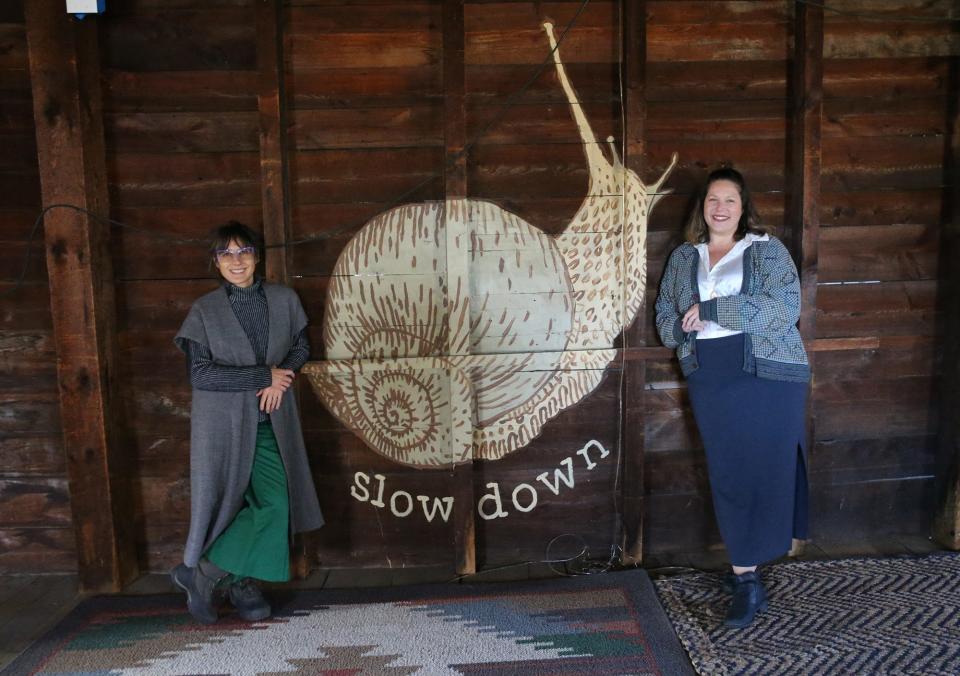 Stella McShera, left, and Casey Philbrick, co-founders of The Clothing Library, say the snail depicts McShera's philosophy to slow down.