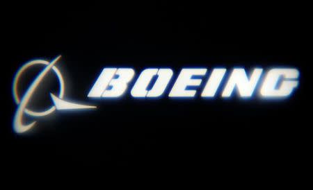 FILE PHOTO: The Boeing Company logo is projected on a wall at the "What's Next?" conference in Chicago, Illinois, U.S., October 4, 2016. REUTERS/Jim Young