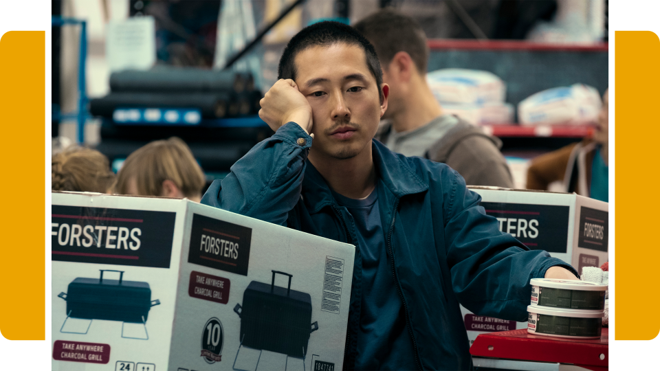 Danny, played by Steven Yeun, wears outfits that serve as a stark contrast to Amy’s carefully curated wardrobe.