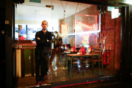 Oliver Kenny, the owner of Apollo Pizzeria, poses at his restaurant in London, Britain, January 22, 2019. REUTERS/Henry Nicholls