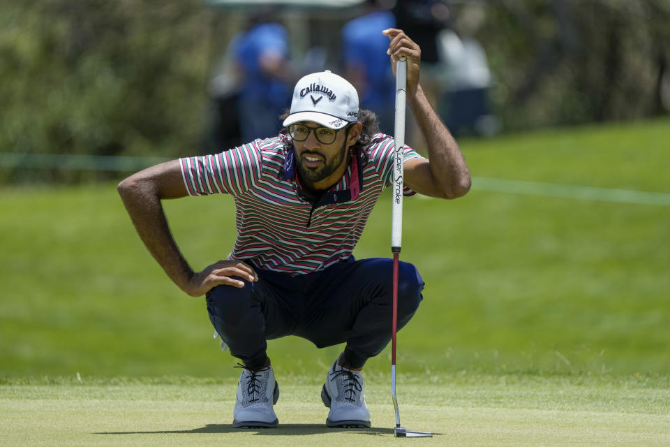 Akshay Bhatia, of the United States, prepares to putt on the 10th green during the Mexico Open golf tournament's third round in Puerto Vallarta, Mexico, Saturday, April 29, 2023. (AP Photo/Moises Castillo)