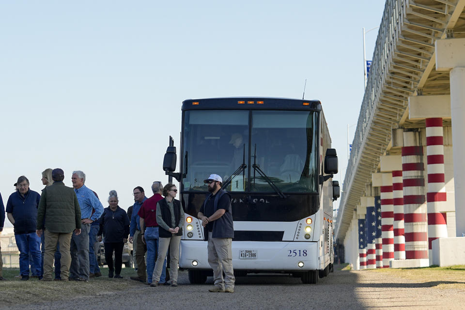 Republican members of Congress arrive via bus at a the Texas-Mexico border, Wednesday, Jan. 3, 2024, in Eagle Pass, Texas. U.S. House Speaker Mike Johnson is leading about 60 fellow Republicans in Congress on a visit to the Mexican border. Their trip comes as they are demanding hard-line immigration policies in exchange for backing President Joe Biden's emergency wartime funding request for Ukraine. (AP Photo/Eric Gay)