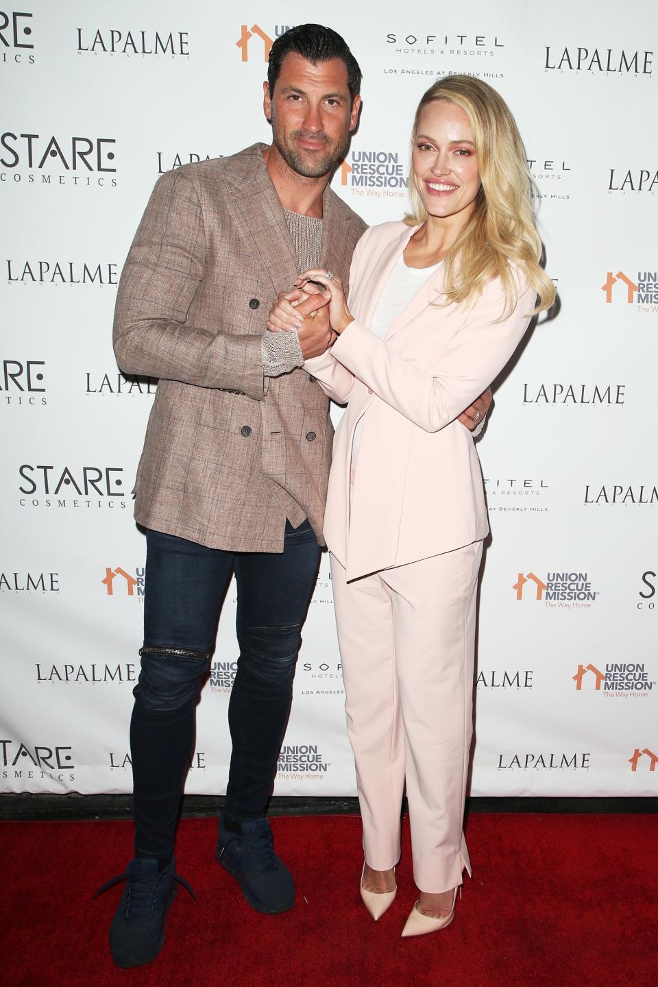 <i>Dancing With the Stars</i> alums Maksim Chmerkovskiy and Peta Murgatroyd hold hands at <i>LaPalme Magazine</i>’s cover stars party at Sofitel Los Angeles in Beverly Hills on Tuesday.