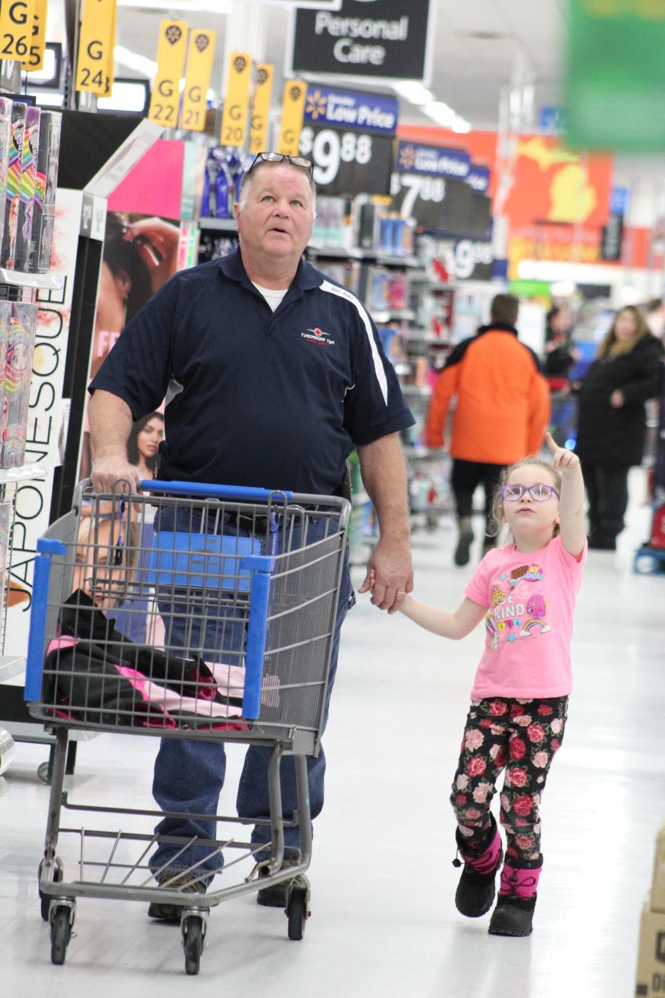 Tuscarora Township Fire Chief Dave Carpenter had a blast shopping with Kyleigh Kenny, who wanted to make sure to get lots of presents for her sister, mom and dad at 2019's Shop with a Hero event. 