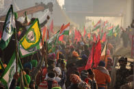 DELHI, INDIA - 2021/01/26: Protesters gathering at the Tikri border during the demonstration. Farmers protesting against agricultural reforms breached barricades and clashed with police in the capital on the India's 72nd Republic Day. The police fired tear gas to restrain them, shortly after a convoy of tractors trundled through the Delhi's outskirts. (Photo by Manish Rajput/SOPA Images/LightRocket via Getty Images)