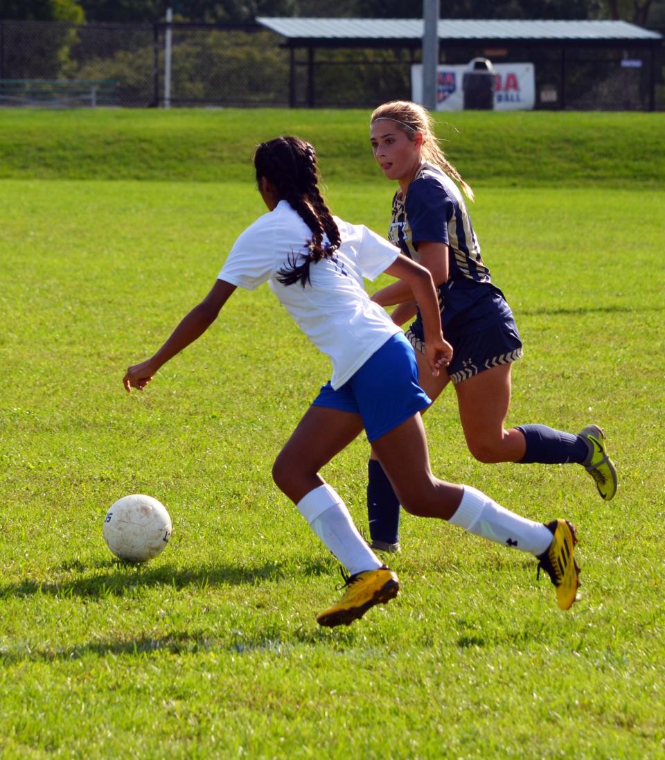 St. Maria Goretti's Mollie Rebuck looks for room to move against McConnellsburg's Faith Peck at Fairgrounds Park in Hagerstown on Sept. 13, 2022. Rebuck had two goals and three assists in the Gaels' 9-1 win.