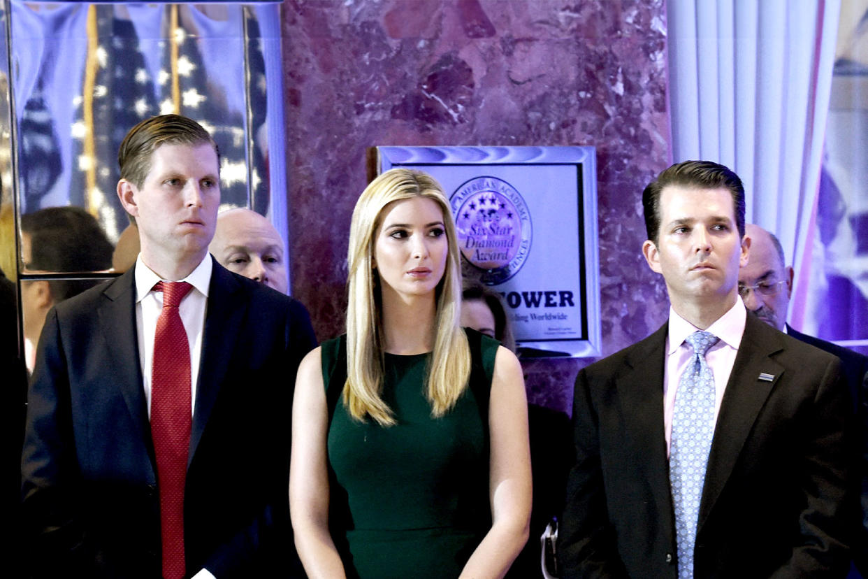 Eric, Ivanka and Donald Jr. look on as Donald Trump speaks during a press conference January 11, 2017 at Trump Tower in New York. TIMOTHY A. CLARY/AFP via Getty Images