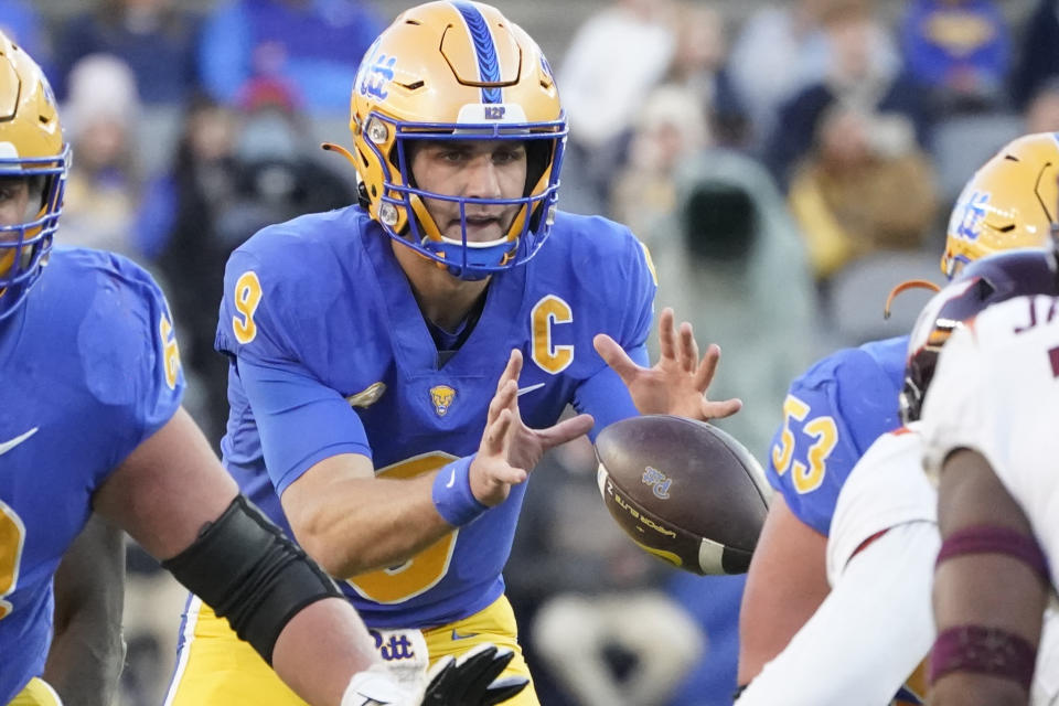 FILE - Pittsburgh quarterback Kedon Slovis (9) takes a snap against Virginia Tech during the second half of an NCAA college football game, Saturday, Oct. 8, 2022, in Pittsburgh. First-year transfer quarterbacks are struggling to adjust to life in the ACC. (AP Photo/Keith Srakocic, File)